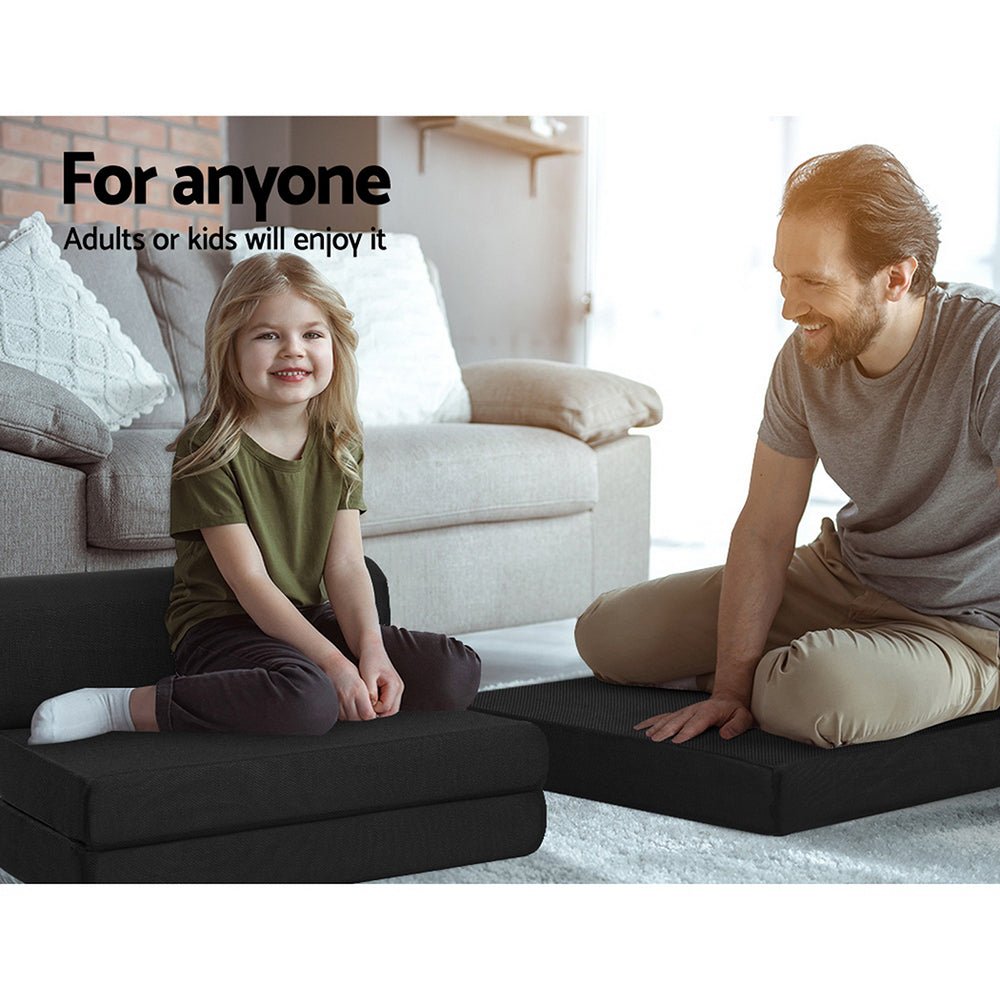 Foldable black foam mattress by Giselle Bedding for kids sleepovers or playtime activities.