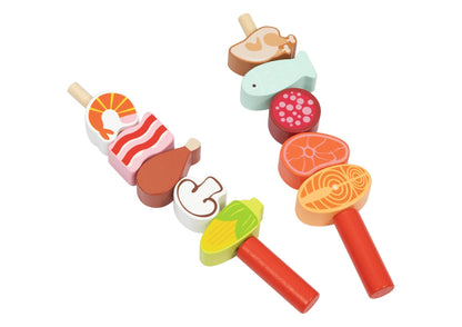 Childrens grill play set for imaginative home cooking fun, includes toy utensils and accessories.