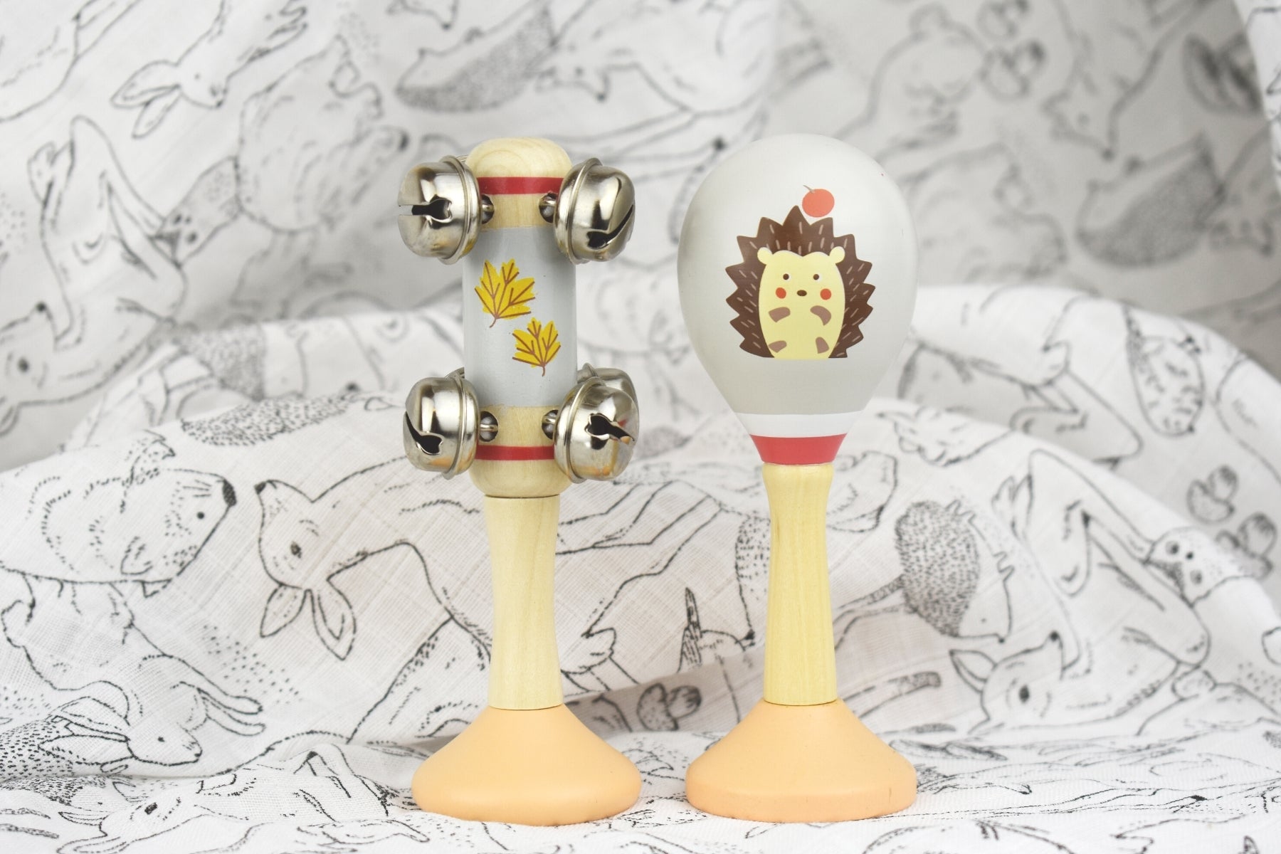 Hedgehog-themed wooden maraca and bell stick set, perfect for musical play at home.