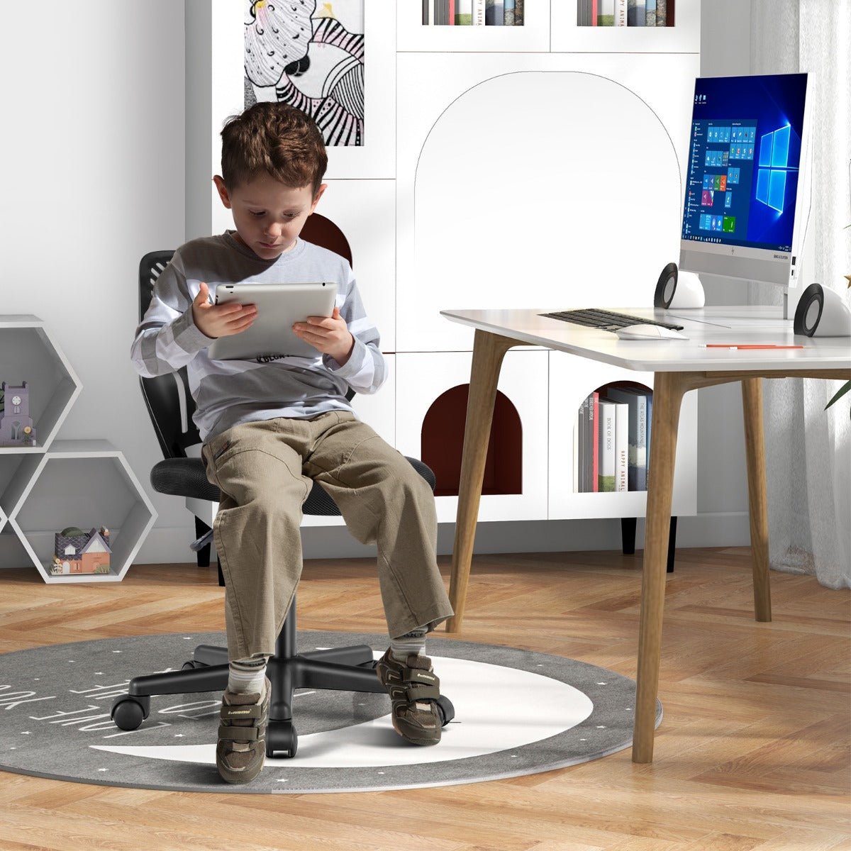 Black adjustable mesh office chair with wheels designed for kids for comfortable home use.
