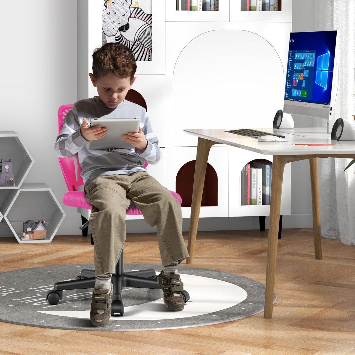 Kids pink mesh office chair with height adjustment and wheels for comfortable studying at home.