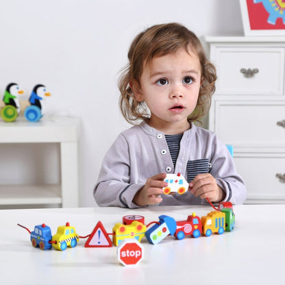 Colorful lacing blocks featuring transportation vehicles for fun and educational play at home.