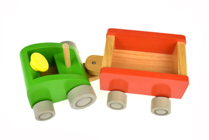 Colorful tractor toy set with milk bottle pins for interactive kids bowling fun at home.