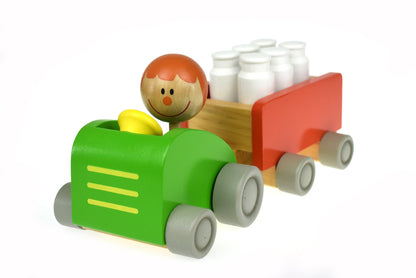 Colorful milk bottle bowling tractor toy for interactive play and motor skill development.