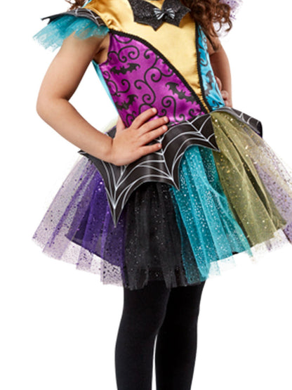 Colorful kids witch costume featuring patchwork design for Halloween dress-up. Playful and vibrant.