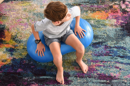 Green peanut balance ball for kids to improve coordination and core strength at home.