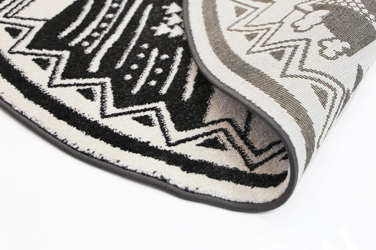 Adorable black and white kid rug shaped like a camping adventure, perfect for playtime.