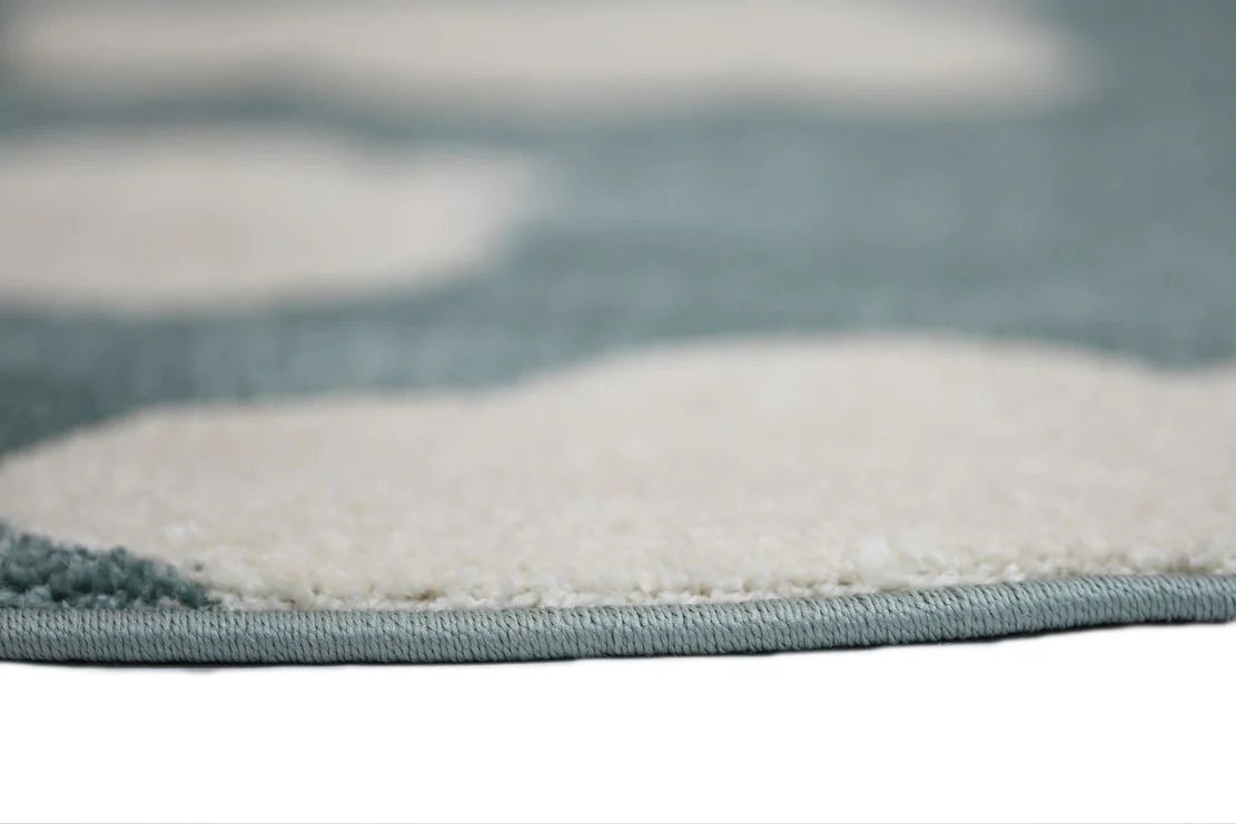 Petit Clouds Aqua and White Kid Rug | Soft, playful rug for childrens room decor.