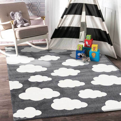 Petit Clouds Dark Grey and White Kid Rug | Soft, cloud-shaped rug perfect for childrens rooms.