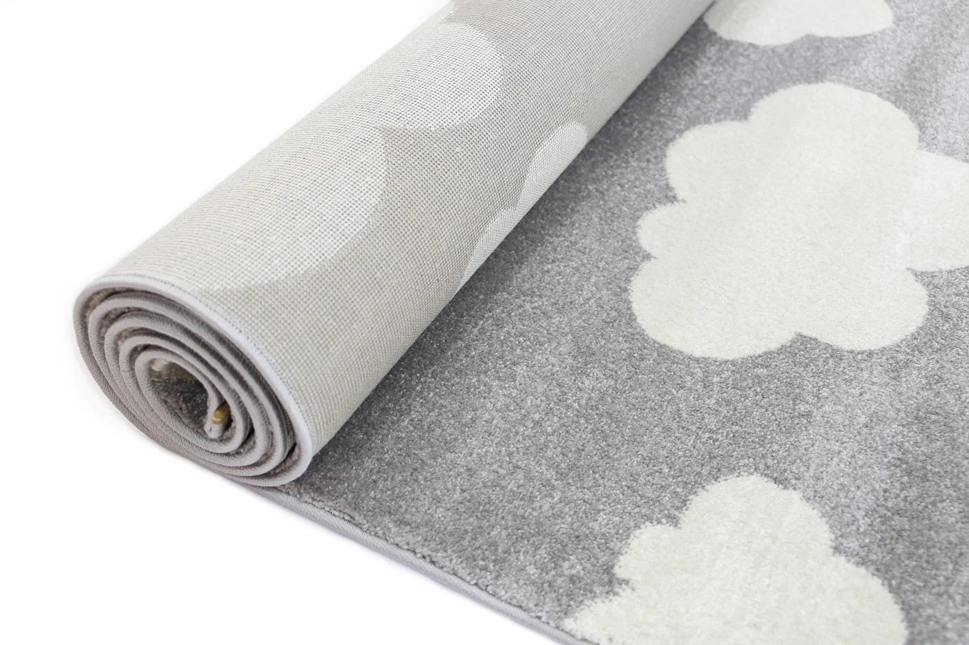 Soft grey and white cloud-shaped kid rug for cozy and adorable bedroom decor.