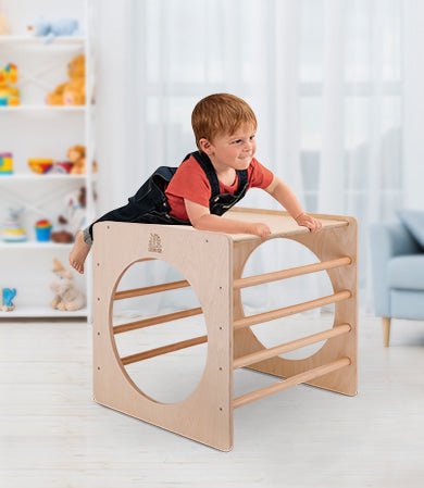 Pikler wooden climbing cube designed for toddlers, promoting active play and motor skill development.