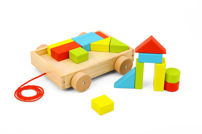 Small pull along cart with colorful blocks for interactive play and storage at home.