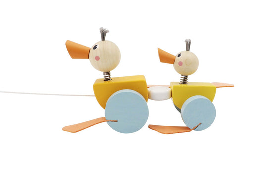 Colorful pull along ducks toy for toddlers, promoting motor skills and imaginative play.