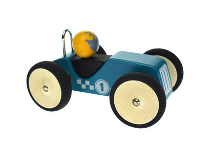 Vintage-inspired green racing car toy for kids playtime and home decor accents.