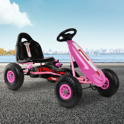 Pink RIGO Kids Pedal Go Kart for fun indoor/outdoor playtime, perfect for children.