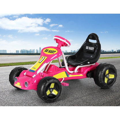 Pink pedal-powered go-kart with plastic tires for childrens home racing fun.