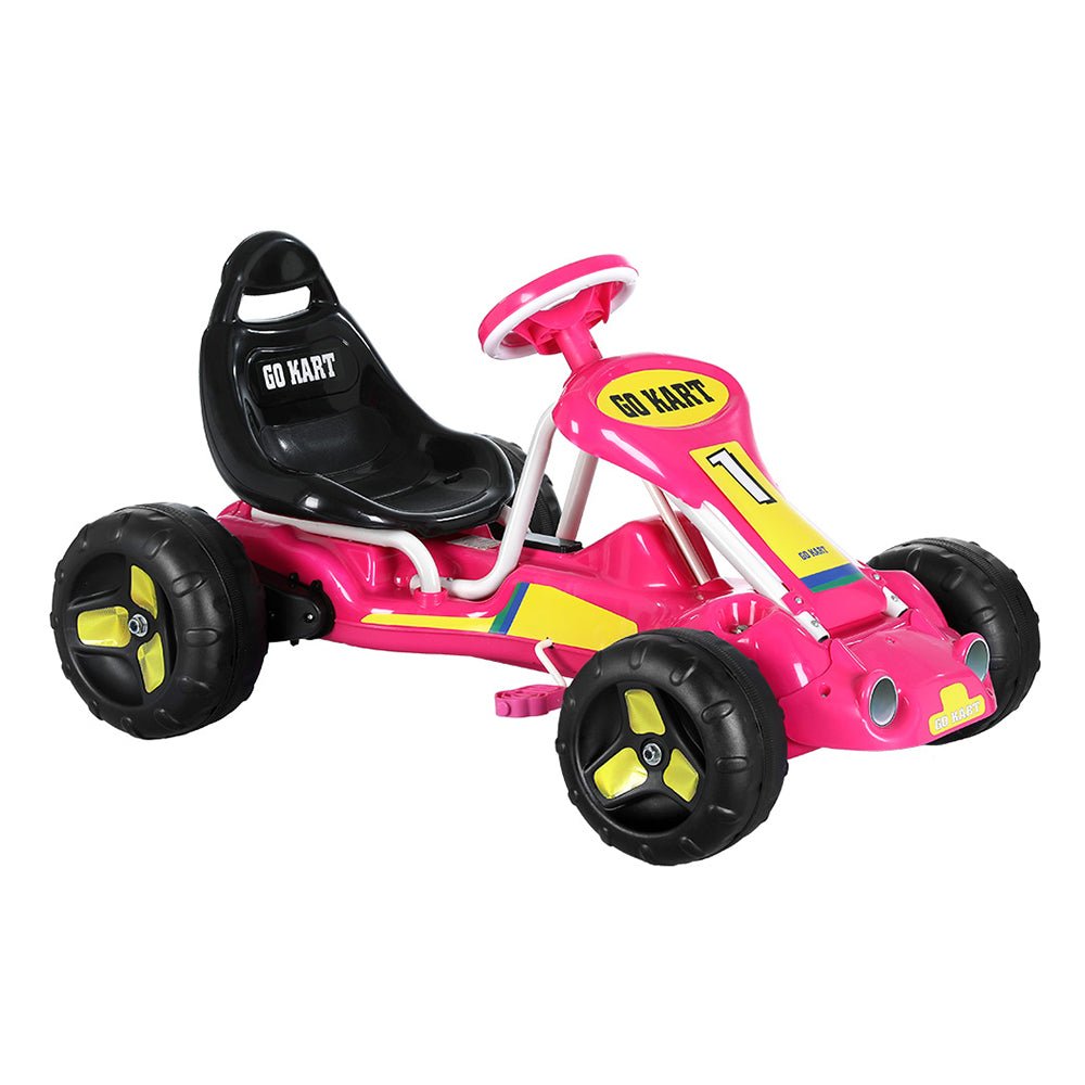 Pink pedal-powered go kart toy with plastic tires for childrens racing adventures at home.