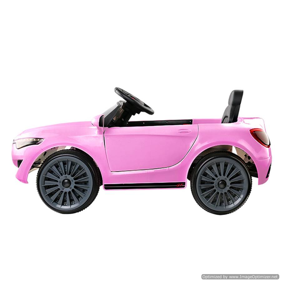 Pink 12v ride-on car modeled after Maserati, ideal for kids imaginative play at home.