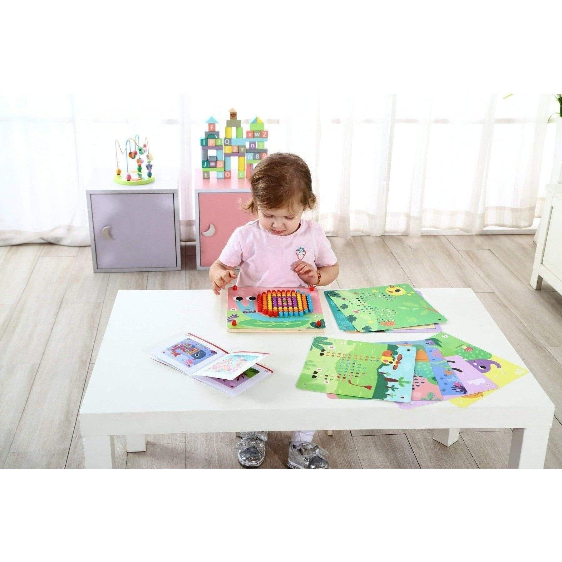 Colorful small peg board game for kids, Tooky Toy pattern design, engaging tactile learning.