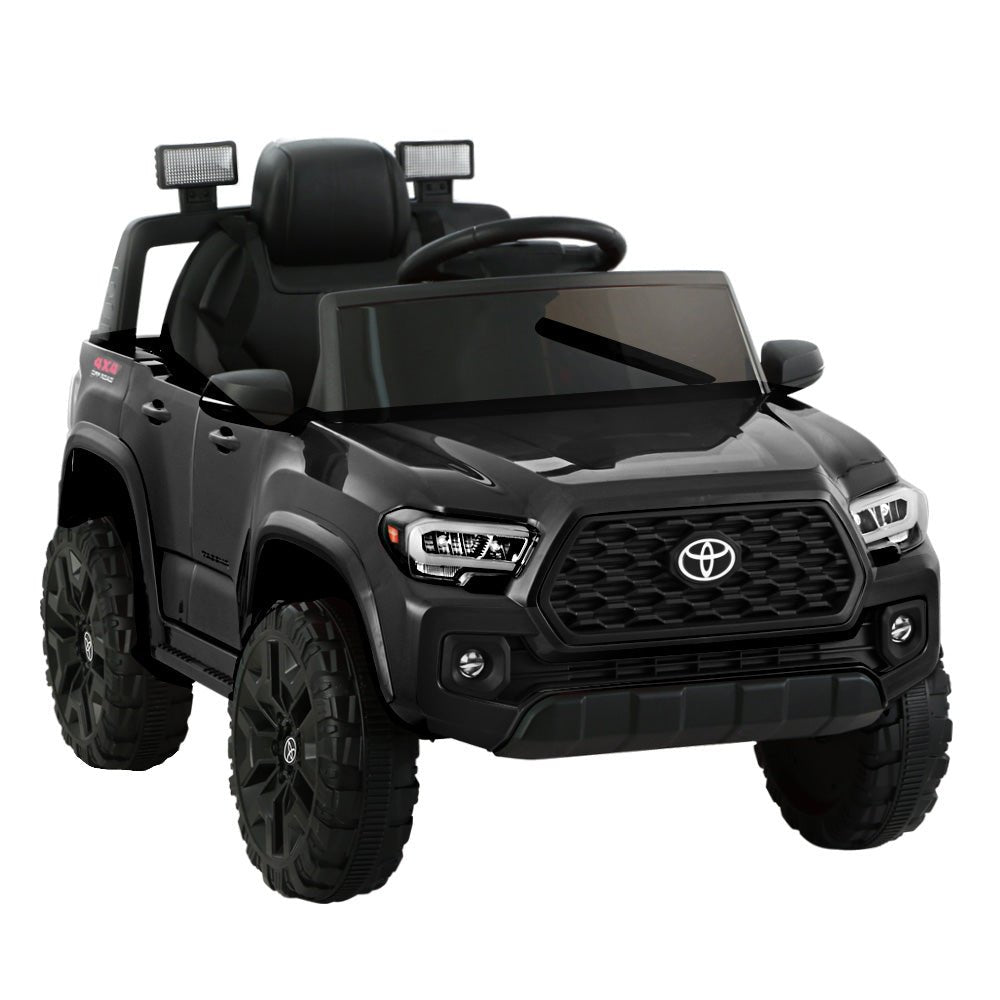 Black 12V battery-powered Toyota Tacoma kids electric ride-on car for off-road adventures.