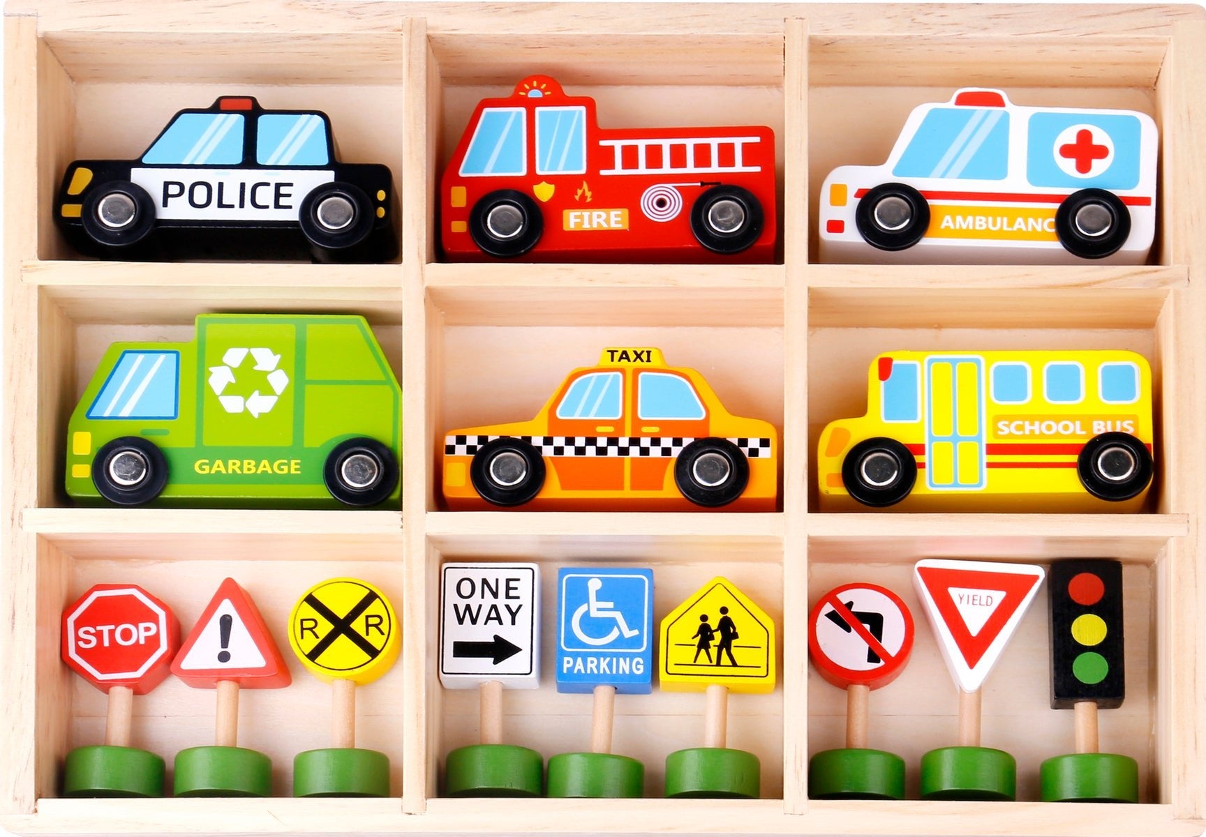An assortment of wooden toy vehicles with accompanying road signs