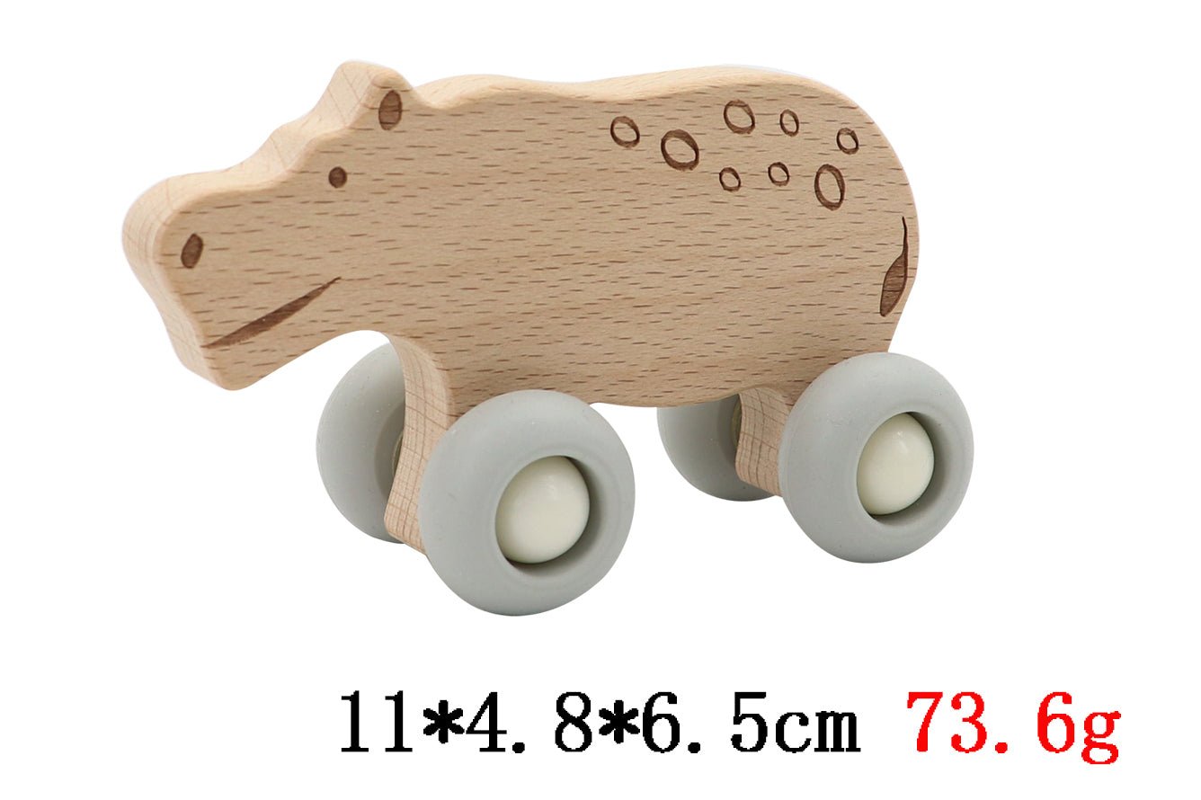 Wooden hippopotamus toy with silicone wheels for imaginative play in kids rooms.