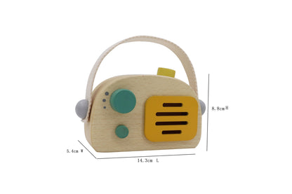 Wooden vintage-style green transistor music box radio for kids imaginative play and decor.