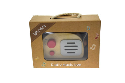 Vintage-style wooden toy radio music box for toddlers, ideal for imaginative play at home.