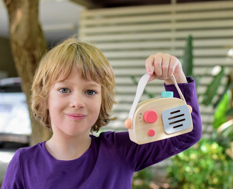 Wooden toy radio music box for toddlers, vintage-style educational toy perfect for creative play.