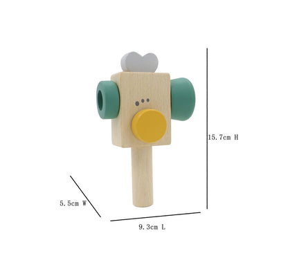 Green wooden toy video recorder for creative play and storytelling at home.